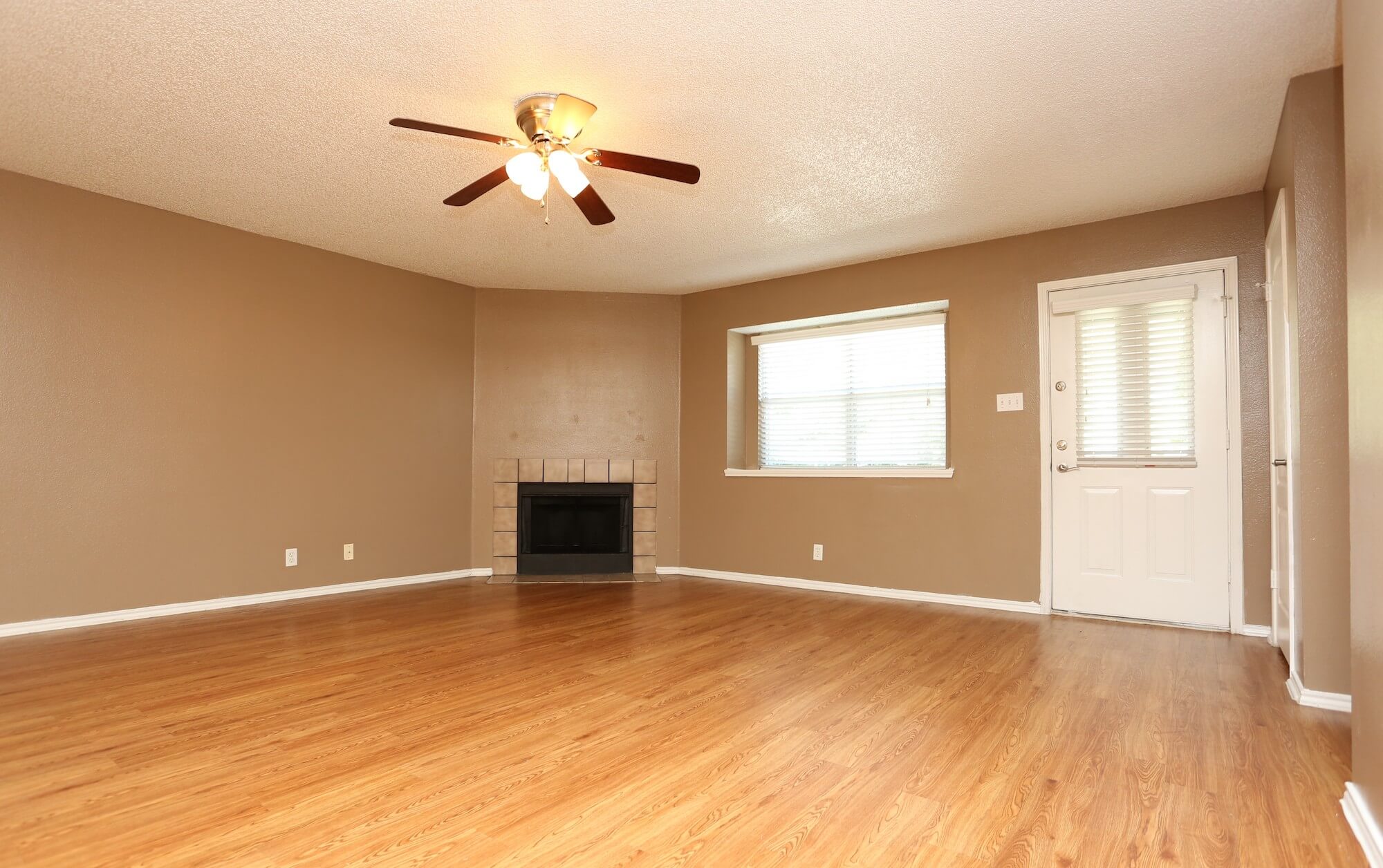 Living room with entrance to patio.