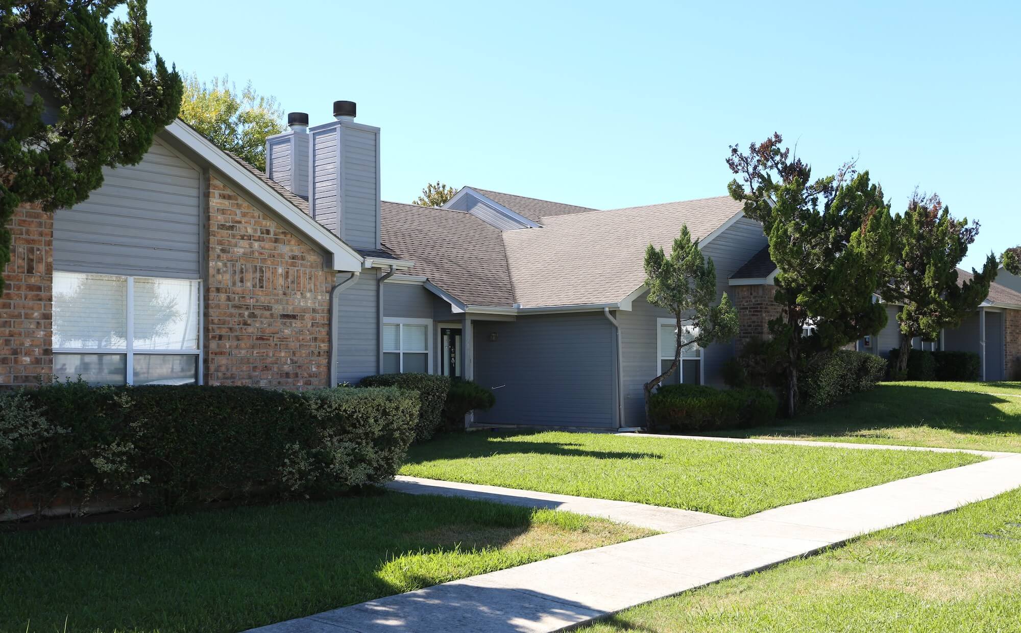 Country View Buildings, painted blue with brick exteriors